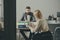 Businessman and businesswoman sit at office desk. Bearded man and woman have business meeting. Concentration at work