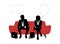 Businessman and businesswoman speaking seated on red sofa