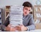 Businessman busy with paperwork in office