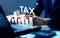 Businessman calculating annual taxes and paying taxes. Tax deduction planning concept. Expenses, account, VAT, income tax,