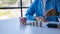 Businessman calculating savings with pile of coins on table, importance of bank