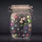 Businessman captured in a glass jar with colourful app icons con