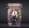 Businessman captured in a glass jar with colourful app icons con