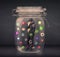 Businessman captured in a glass jar with colourful app icons con