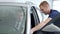 Businessman in a car salon. Man looking at the car