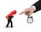 Businessman carrying red arrow sign with big forefinger pointing