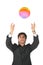 Businessman catches multicolor ball