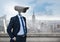 Businessman with CCTV head with city skyline