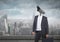 Businessman with CCTV head with city skyline