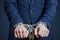 Businessman chained in a chain. Man arrested for crimes