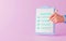 Businessman checklist document and approval or signing contract concept on pink background