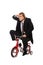 Businessman on childish bycicle