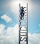 Businessman climbing the career ladder of success