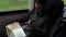 Businessman Commuting To Work On Train Using Mobile Phone.