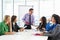 Businessman Conducting Meeting In Boardroom