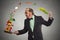 Businessman cooking vegetables with a pan