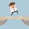 Businessman cross the cliff gap by wooden board as a bridge.