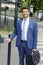 Businessman crossing road in city