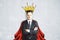 Businessman with crown and cape