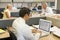 Businessman in cubicle at laptop