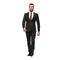 Businessman in dark suit walking forward, isolated polygonal