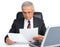 Businessman at desk with computer and papers