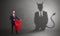 Businessman with devil shadow and toreador concept