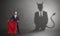 Businessman with devil shadow and toreador concept