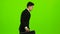 Businessman is a diplomat, a telephone rings to him and he talks. Green screen
