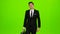 Businessman is a diplomat, a telephone rings to him and he talks. Green screen
