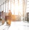 Businessman discussing plans with businesswoman in airport