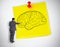 Businessman drawing a brain on a giant post it