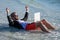 Businessman dreams on summer business in sea. Unwind through travel. Businessman relaxing at the beach. Remote working