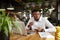 Businessman drinking coffee in cafe resting after work with laptop.