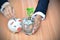 Businessman drop coin into the piggy bank and coins with tree in