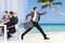 Businessman escaping from conference meeting towards beach