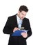 Businessman examining document on clipboard