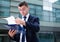 Businessman is examining documents before signing