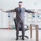 Businessman exercising in office wearing VR glasses