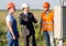 Businessman explaining working process of solar panels to employees.