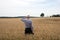 Businessman explore in the wheat field