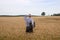 Businessman explore in the wheat field