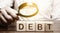 Businessman explores debt. Study of the structure of debt, restructuring and the abolition of penalties, illegal charges