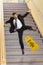 Businessman Falling on Stais