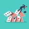 Businessman falls from a house of cards. Shaky position.