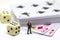 Businessman figure and table game accessories. Poker with dice. Poker hand.