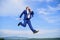 Businessman formal suit jump while call smartphone sky background. Businessman solving business problems on phone