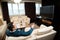 Businessman in formal suit sitting on sofa in hotel room