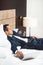 Businessman in formal suit sleeping on a bed