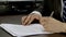 Businessman in formal wear signing contract closeup on the desk